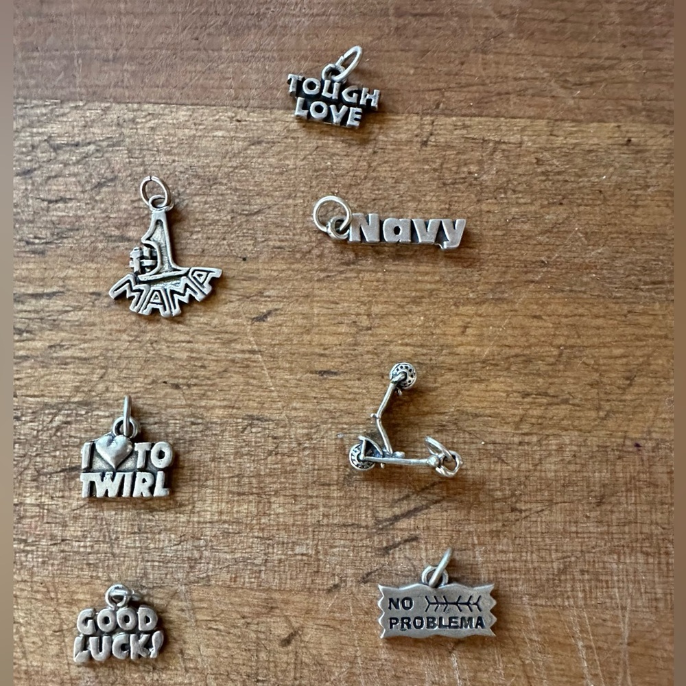 7 Sterling silver charms, sold as lot # 5.